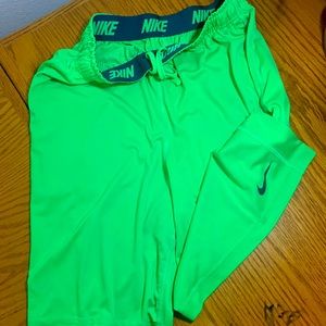 Medium Men’s NIKE Dry Fit Athletics shorts in lime green color.
